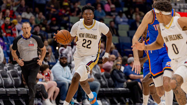 Nov 17, 2025; New Orleans, Louisiana, USA;  New Orleans Pelicans center Derik Queen (22) brings the ball up court against the Oklahoma City Thunder during the second half at Smoothie King Center. Mandatory Credit: Stephen Lew-Imagn Images