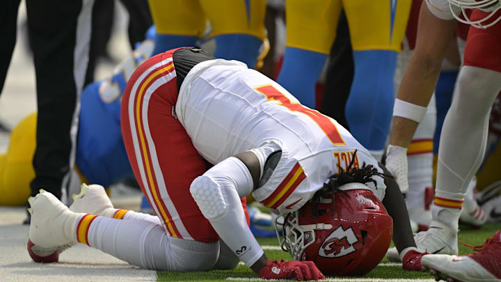 Sep 29, 2024; Inglewood, California, USA;  Kansas City Chiefs wide receiver Rashee Rice (4) pounds his fist on the ground after an injury in the first half against the Los Angeles Chargers at SoFi Stadium. Mandatory Credit: Jayne Kamin-Oncea-Imagn Images