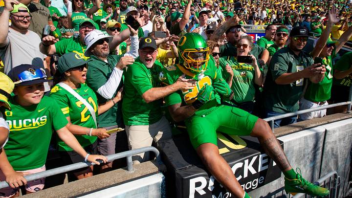Oregon Ducks linebacker Ashton Porter leaps into the stands as the Oregon Ducks host the Idaho Vandals Saturday, Aug. 31, 2024 at Autzen Stadium in Eugene, Ore. Oregon Ducks linebacker Ashton Porter leaps into the stands as the Oregon Ducks host the Idaho Vandals Saturday, Aug. 31, 2024 at Autzen Stadium in Eugene, Ore.