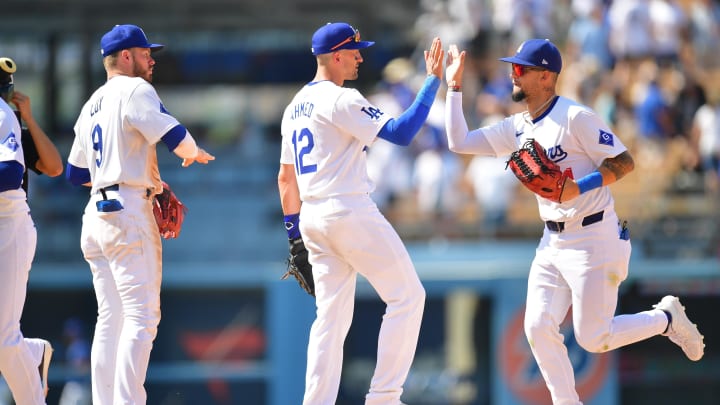 Jul 25, 2024; Los Angeles, California, USA; Los Angeles Dodgers second baseman Gavin Lux (9) shortstop Nick Ahmed (12) and center fielder Andy Pages (44) celebrate the victory against the San Francisco Giants at Dodger Stadium. Mandatory Credit: Gary A. Vasquez-USA TODAY Sports