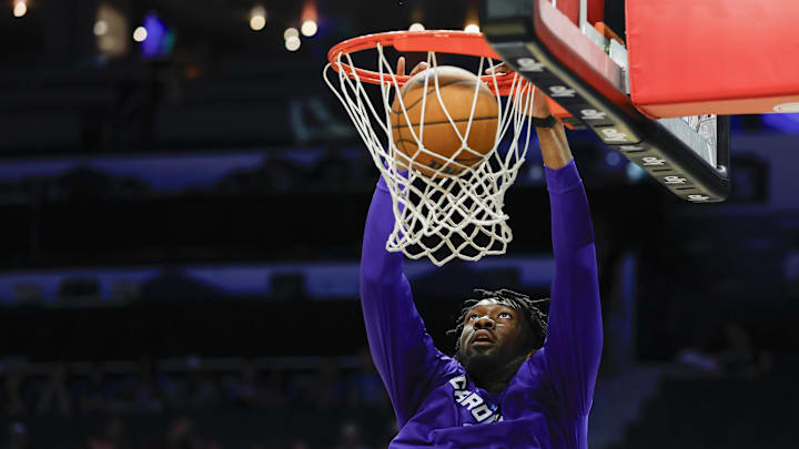 Apr 6, 2025; Charlotte, North Carolina, USA; Charlotte Hornets center Mark Williams (5) dunks as he warms up before a game against the Chicago Bulls at Spectrum Center. Mandatory Credit: Nell Redmond-Imagn Images