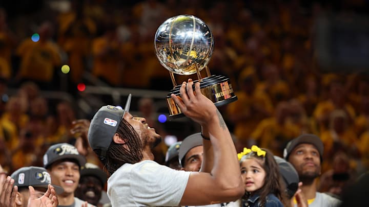 May 31, 2025; Indianapolis, Indiana, USA; Indiana Pacers center Myles Turner (33) raises the trophy after game six of the eastern conference finals against the New York Knicks for the 2025 NBA Playoffs at Gainbridge Fieldhouse. Mandatory Credit: Trevor Ruszkowski-Imagn Images