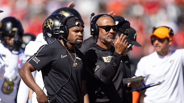 Oct 19, 2024; Tucson, Arizona, USA; Colorado Buffalos graduate assistant Rashad Davis (left) alongside wide receivers coach Jason Phillips against the Arizona Wildcats at Arizona Stadium. Mandatory Credit: Mark J. Rebilas-Imagn Images Oct 19, 2024; Tucson, Arizona, USA; Colorado Buffalos graduate assistant Rashad Davis (left) alongside wide receivers coach Jason Phillips against the Arizona Wildcats at Arizona Stadium. Mandatory Credit: Mark J. Rebilas-Imagn Images
