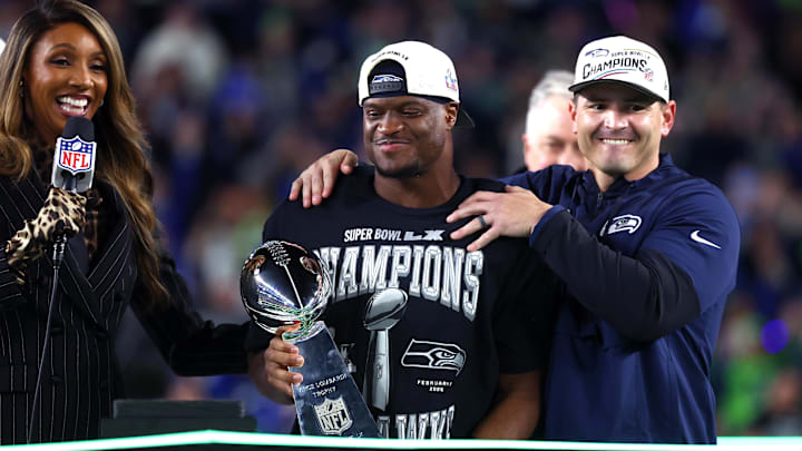 Feb 8, 2026; Santa Clara, CA, USA; Seattle Seahawks head coach Mike MacDonald and running back Kenneth Walker III (9) celebrate with the Vince Lombardi trophy after defeating the New England Patriots in Super Bowl LX at Levi's Stadium. Mandatory Credit: Mark J. Rebilas-Imagn Images