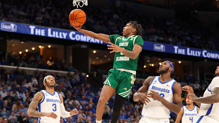 Mar 7, 2025; Memphis, Tennessee, USA; South Florida Bulls guard Jayden Reid (0) shoots the ball against the Memphis Tigers during the second half at FedExForum. Mandatory Credit: Wesley Hale-Imagn Images