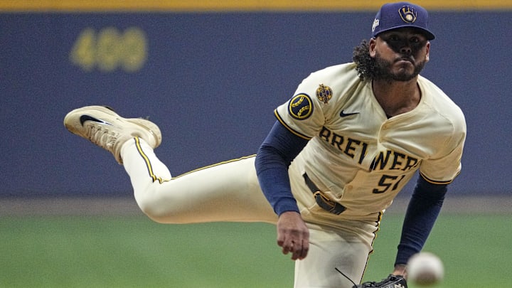 Oct 14, 2025; Milwaukee, Wisconsin, USA; Milwaukee Brewers pitcher Freddy Peralta (51) throws pitch against the Los Angeles Dodgers in the first inning during game two of the NLCS round for the 2025 MLB playoffs at American Family Field. Mandatory Credit: Michael McLoone-Imagn Images