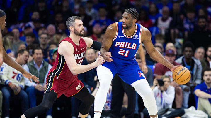 Apr 17, 2024; Philadelphia, Pennsylvania, USA; Philadelphia 76ers center Joel Embiid (21) controls the ball against Miami Heat forward Kevin Love (42) during the first quarter of a play-in game of the 2024 NBA playoffs at Wells Fargo Center. Mandatory Credit: Bill Streicher-Imagn Images Apr 17, 2024; Philadelphia, Pennsylvania, USA; Philadelphia 76ers center Joel Embiid (21) controls the ball against Miami Heat forward Kevin Love (42) during the first quarter of a play-in game of the 2024 NBA playoffs at Wells Fargo Center. Mandatory Credit: Bill Streicher-Imagn Images