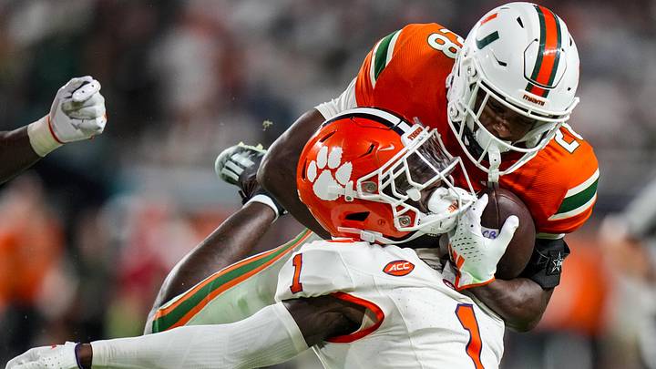 Oct 21, 2023; Miami Gardens, Florida, USA; Clemson Tigers safety Andrew Mukuba (1) tackles Miami Hurricanes running back Ajay Allen (28) during over time at Hard Rock Stadium. Mandatory Credit: Rich Storry-Imagn Images Oct 21, 2023; Miami Gardens, Florida, USA; Clemson Tigers safety Andrew Mukuba (1) tackles Miami Hurricanes running back Ajay Allen (28) during over time at Hard Rock Stadium. Mandatory Credit: Rich Storry-Imagn Images