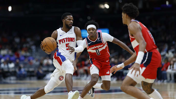 Nov 17, 2024; Washington, District of Columbia, USA; Detroit Pistons guard Malik Beasley (5) drives to the basket as Washington Wizards guard Bilal Coulibaly (0) and Wizards guard Jordan Poole (13) defend in the first half at Capital One Arena. Mandatory Credit: Geoff Burke-Imagn Images