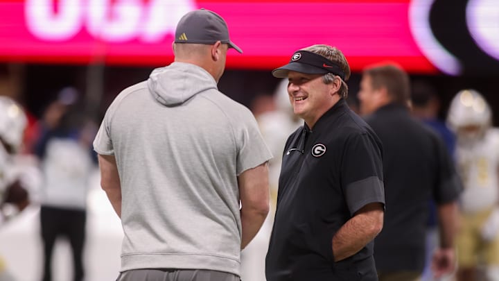 Nov 28, 2025; Atlanta, Georgia, USA; Georgia Tech Yellow Jackets head coach Brent Key talks to Georgia Bulldogs head coach Kirby Smart before a game at Mercedes-Benz Stadium. Mandatory Credit: Brett Davis-Imagn Images