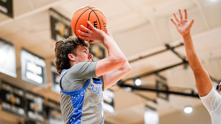 Barron Collier Cougars guard Spencer Clayton (1) passes the ball during the second quarter of a Holiday Hoopfest game against the Taravella Trojans at Bishop Verot High School in Fort Myers, Fla., on Friday, Dec. 27, 2024.