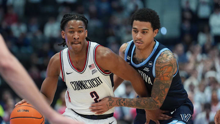Jan 24, 2026; Storrs, Connecticut, USA; UConn Huskies guard Silas Demary Jr. (2) drives the ball against Villanova Wildcats guard Bryce Lindsay (2) in the second half at Harry A. Gampel Pavilion. Mandatory Credit: David Butler II-Imagn Images