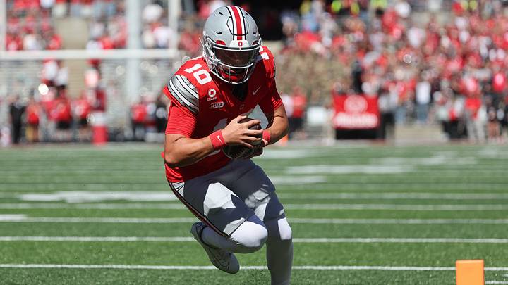 Sep 26, 2026; Columbus, Ohio, USA; Ohio State Buckeyes quarterback Julian Sayin (10) scores a rushing touchdown against the Illinois Fighting Illini during the first half at Ohio Stadium. Mandatory Credit: Joseph Maiorana-Imagn Images Sep 26, 2026; Columbus, Ohio, USA; Ohio State Buckeyes quarterback Julian Sayin (10) scores a rushing touchdown against the Illinois Fighting Illini during the first half at Ohio Stadium. Mandatory Credit: Joseph Maiorana-Imagn Images