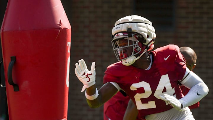 The Crimson Tide players and coaches work during practice Tuesday, Aug. 6, 2024. Alabama linebacker Noah Carter (24) runs a pass rush drill.