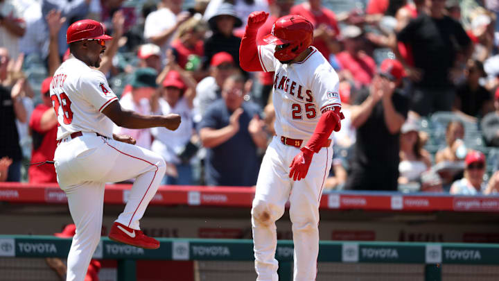 Jun 25, 2025; Anaheim, California, USA; Los Angeles Angels catcher Travis d'Arnaud (25) celebrates with third base coach Bo Porter (88) after hitting a home run during the fourth inning against the Boston Red Sox at Angel Stadium. Mandatory Credit: Kiyoshi Mio-Imagn Images Jun 25, 2025; Anaheim, California, USA; Los Angeles Angels catcher Travis d'Arnaud (25) celebrates with third base coach Bo Porter (88) after hitting a home run during the fourth inning against the Boston Red Sox at Angel Stadium. Mandatory Credit: Kiyoshi Mio-Imagn Images