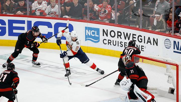 May 28, 2025; Raleigh, North Carolina, USA; Florida Panthers center Aleksander Barkov (16) skates with the puck past Carolina Hurricanes defenseman Dmitry Orlov (7) and Hurricanes left wing Eric Robinson (50) en route to assisting on the series clinching goal by Florida Panthers center Carter Verhaeghe (not pictured) in game five of the Eastern Conference Final of the 2025 Stanley Cup Playoffs at Lenovo Center. Mandatory Credit: Geoff Burke-Imagn Images May 28, 2025; Raleigh, North Carolina, USA; Florida Panthers center Aleksander Barkov (16) skates with the puck past Carolina Hurricanes defenseman Dmitry Orlov (7) and Hurricanes left wing Eric Robinson (50) en route to assisting on the series clinching goal by Florida Panthers center Carter Verhaeghe (not pictured) in game five of the Eastern Conference Final of the 2025 Stanley Cup Playoffs at Lenovo Center. Mandatory Credit: Geoff Burke-Imagn Images