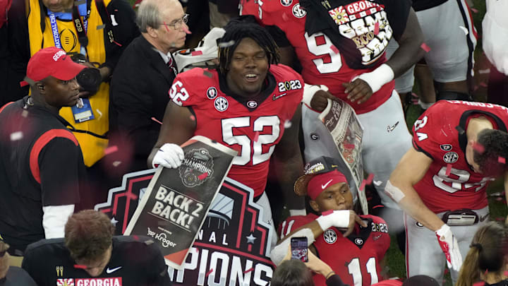 Jan 9, 2023; Inglewood, CA, USA; Georgia Bulldogs defensive lineman Christen Miller (52) celebrates with teammates after the Bulldogs defeated the TCU Horned Frogs in the CFP national championship game at SoFi Stadium. Mandatory Credit: Robert Hanashiro-Imagn Images