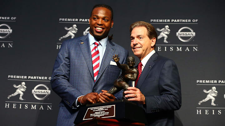Dec 12, 2015; New York, NY, USA; Alabama running back Derrick Henry (left) and head coach Nick Saban pose with the Heisman Trophy during a press conference at the New York Marriott Marquis after the 81st annual Heisman Trophy presentation. Mandatory Credit: Brad Penner-Imagn Images Dec 12, 2015; New York, NY, USA; Alabama running back Derrick Henry (left) and head coach Nick Saban pose with the Heisman Trophy during a press conference at the New York Marriott Marquis after the 81st annual Heisman Trophy presentation. Mandatory Credit: Brad Penner-Imagn Images