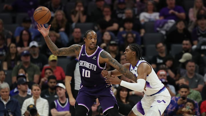 Mar 15, 2026; Sacramento, California, USA; Sacramento Kings guard-forward DeMar DeRozan (10) catches the ball while being defended by Utah Jazz forward Cody Williams (5) during the fourth quarter at Golden 1 Center. Mandatory Credit: Dennis Lee-Imagn Images