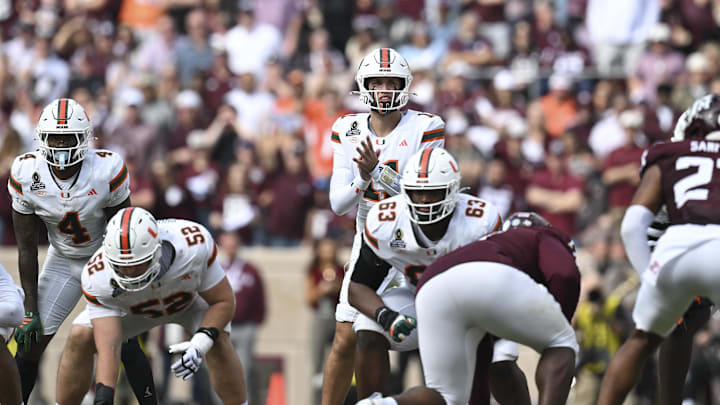 Dec 20, 2025; College Station, TX, USA; Miami Hurricanes quarterback Carson Beck (11) call the play during the first half of the first round game of the CFP National Playoff against the Texas A&M Aggies at Kyle Field. Mandatory Credit: Maria Lysaker-Imagn Images
