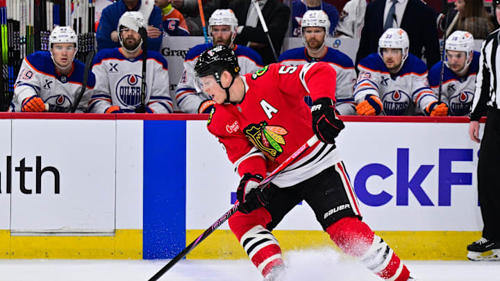 Feb 5, 2025; Chicago, Illinois, USA; Chicago Blackhawks defenseman Connor Murphy (5) skates with the puck against the Edmonton Oilers during the first period at the United Center. Mandatory Credit: Daniel Bartel-Imagn Images