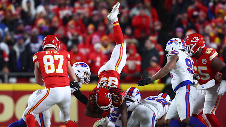 Jan 26, 2025; Kansas City, MO, USA;Kansas City Chiefs running back Kareem Hunt (29) is tackled by the Buffalo Bills during the first half in the AFC Championship game at GEHA Field at Arrowhead Stadium. Mandatory Credit: Mark J. Rebilas-Imagn Images