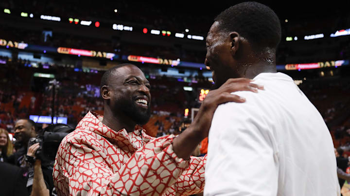 Apr 9, 2023; Miami, Florida, USA; Former Miami Heat player Dwyane Wade talks to Miami Heat center Bam Adebayo (13) prior to the game against the Orlando Magic at Kaseya Center. Mandatory Credit: Sam Navarro-Imagn Images