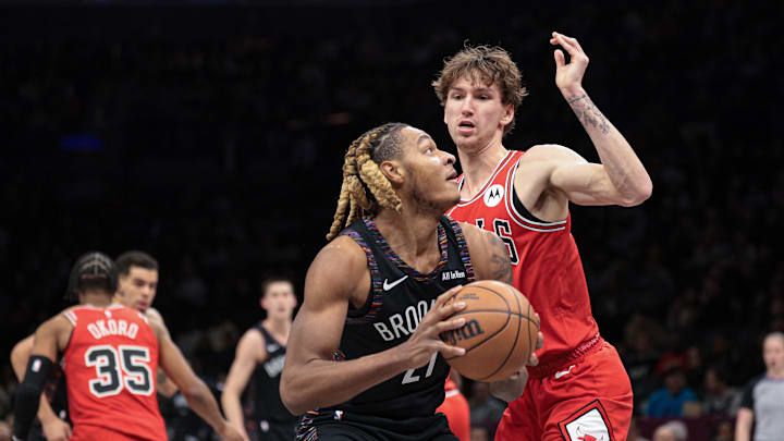 Jan 16, 2026; Brooklyn, New York, USA; Brooklyn Nets forward Noah Clowney (21) goes to the basket against Chicago Bulls forward Matas Buzelis (14) during the first quarter at Barclays Center. Mandatory Credit: Vincent Carchietta-Imagn Images