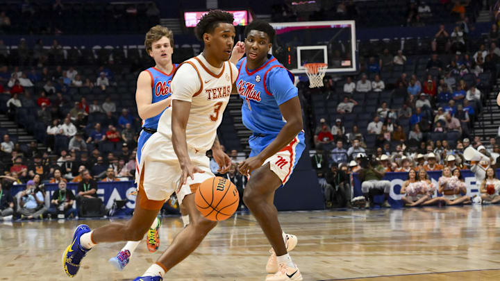 Texas Longhorns forward Dailyn Swain drives to the basket past Mississippi Rebels forward Malik Dia during the first half at Bridgestone Arena. 