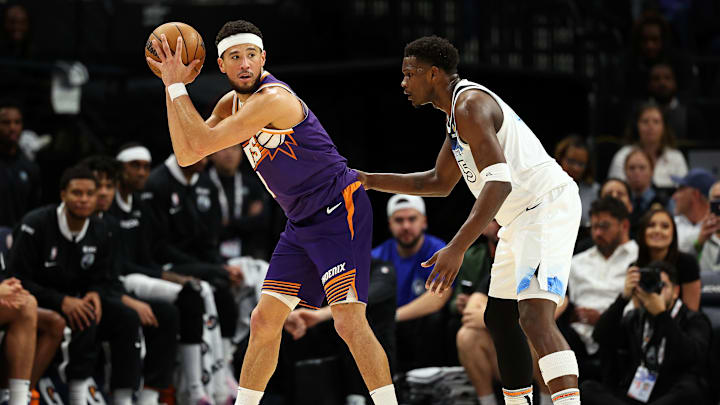Suns' Devin Booker (left) pictured alongside Wolves' Anthony Edwards (right)