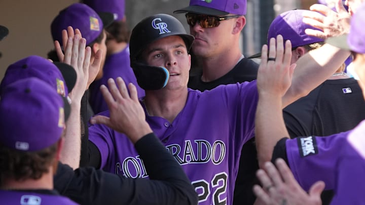 Colorado Rockies right fielder Mickey Moniak celebrates with teammates 