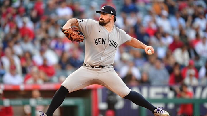 May 27, 2025; Anaheim, California, USA; New York Yankees pitcher Carlos Rodón (55) throws against the Los Angeles Angels during the first inning at Angel Stadium. Mandatory Credit: Gary A. Vasquez-Imagn Images