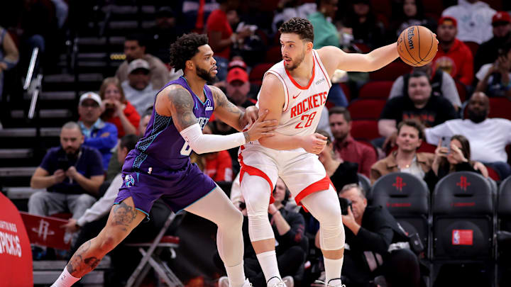 Feb 5, 2026; Houston, Texas, USA; Houston Rockets center Alperen Sengun (28) dribbles against Charlotte Hornets forward Miles Bridges (0) during the first quarter at Toyota Center. Mandatory Credit: Erik Williams-Imagn Images