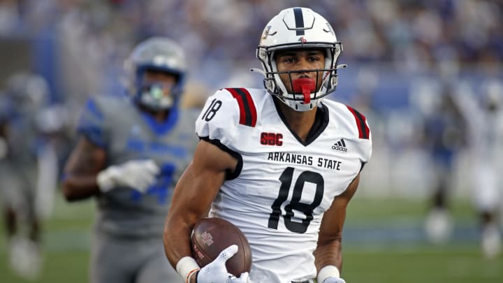 Sep 17, 2022; Memphis, Tennessee, USA; Arkansas State Red Wolves tight end Seydou Traore (18) runs after catch for a touchdown during the first half against the Memphis Tigers at Liberty Bowl Memorial Stadium. Mandatory Credit: Petre Thomas-USA TODAY Sports Sep 17, 2022; Memphis, Tennessee, USA; Arkansas State Red Wolves tight end Seydou Traore (18) runs after catch for a touchdown during the first half against the Memphis Tigers at Liberty Bowl Memorial Stadium. Mandatory Credit: Petre Thomas-USA TODAY Sports