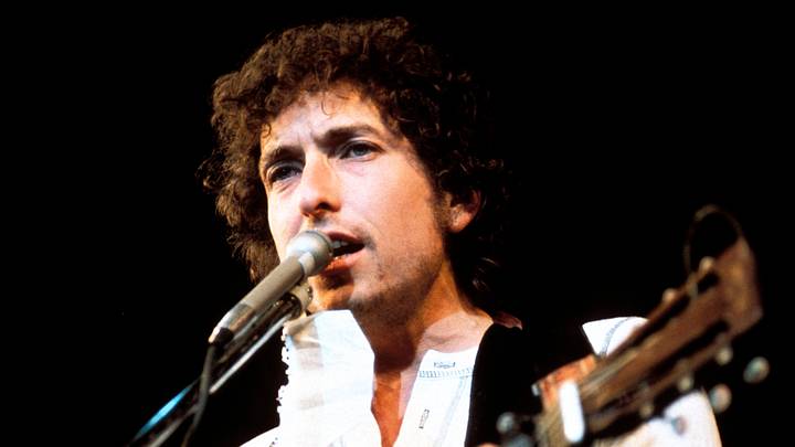 Photo of Bob Dylan playing guitar in the 1970s Photo of Bob Dylan playing guitar in the 1970s