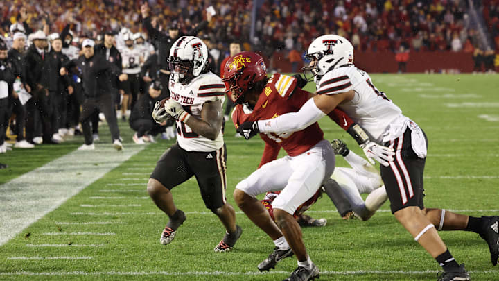 Nov 2, 2024; Ames, Iowa, USA; Texas Tech Red Raiders running back Tahj Brooks (28) scores the game winning touchdown against the Iowa State Cyclones at Jack Trice Stadium. The Red Raiders won 23-22.  Mandatory Credit: Reese Strickland-Imagn Images