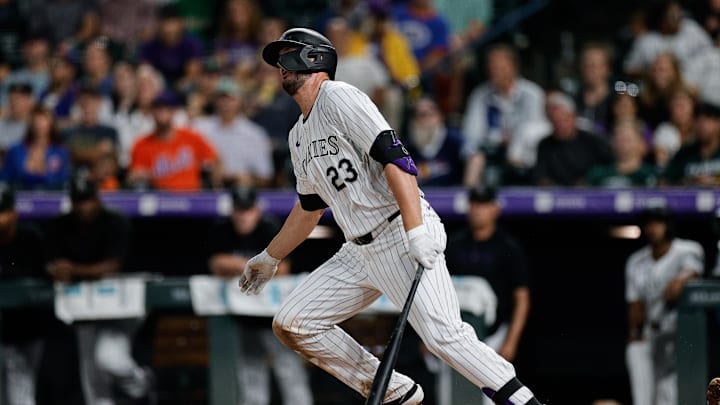 Aug 6, 2024; Denver, Colorado, USA; Colorado Rockies right fielder Kris Bryant (23) hits a double in the eighth inning against the New York Mets at Coors Field.