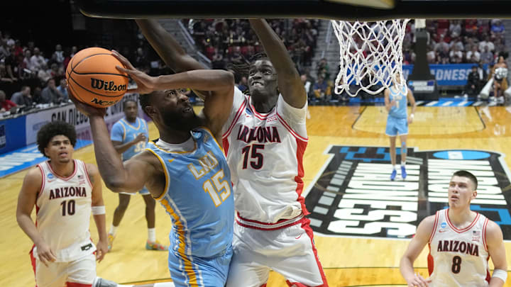 Mar 20, 2026; San Diego, CA, USA; LIU Sharks forward Caleb Johnson (15) shoots against Arizona Wildcats forward Sidi Gueye (15) in the second half during a first round game of the men's 2026 NCAA Tournament at Viejas Arena. Mandatory Credit: Kirby Lee-Imagn Images Mar 20, 2026; San Diego, CA, USA; LIU Sharks forward Caleb Johnson (15) shoots against Arizona Wildcats forward Sidi Gueye (15) in the second half during a first round game of the men's 2026 NCAA Tournament at Viejas Arena. Mandatory Credit: Kirby Lee-Imagn Images