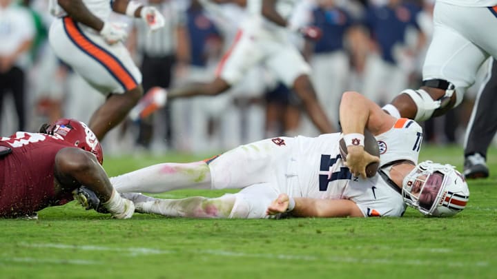 Oklahoma Sooners defensive lineman David Stone (0) brings down Auburn Tigers quarterback Jackson Arnold (11) during a college football game between the University of Oklahoma Sooners (OU) and the Auburn Tigers at Gaylord Family Ð Oklahoma Memorial Stadium in Norman, Okla., Saturday,Sept. 20, 2025. Oklahoma won 24-17.
