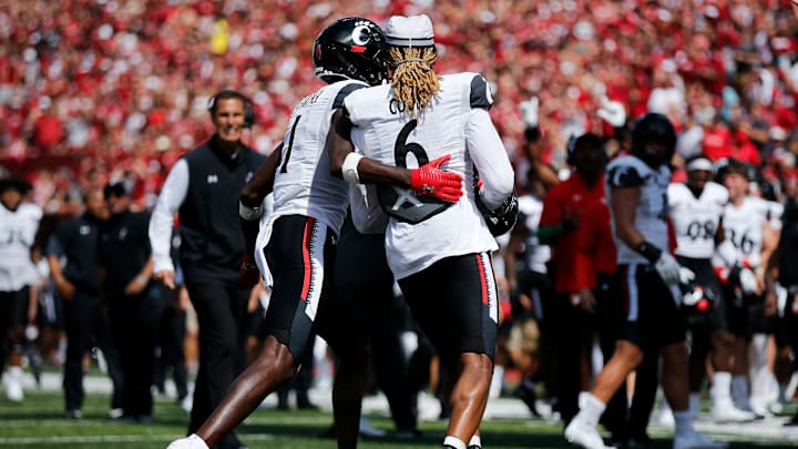 Cincinnati Bearcats head coach Luke Fickell reacts as safety Bryan Cook (6) is penalized for removing his helmet after intercepting a pass in the end zone in the second quarter of the NCAA football game between the Indiana Hoosiers and the Cincinnati Bearcats at Memorial Stadium in Bloomington, Ind., on Saturday, Sept. 18, 2021.

Cincinnati Bearcats At Indiana Hoosiers Football