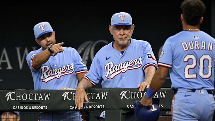 Aug 24, 2025; Arlington, Texas, USA; Texas Rangers manager Bruce Bochy (15) and second baseman Ezequiel Duran (20) celebrate after Duran scores against the Cleveland Guardians during the fourth inning at Globe Life Field. Mandatory Credit: Jerome Miron-Imagn Images Aug 24, 2025; Arlington, Texas, USA; Texas Rangers manager Bruce Bochy (15) and second baseman Ezequiel Duran (20) celebrate after Duran scores against the Cleveland Guardians during the fourth inning at Globe Life Field. Mandatory Credit: Jerome Miron-Imagn Images