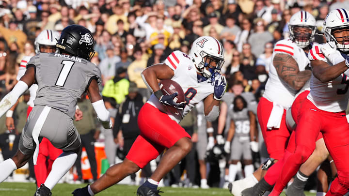 Nov 11, 2023; Boulder, Colorado, USA; Arizona Wildcats running back DJ Williams (8) carries the ball in the second half against the Colorado Buffaloes at Folsom Field. Mandatory Credit: Ron Chenoy-Imagn Images