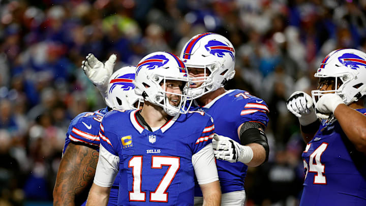 Buffalo Bills quarterback Josh Allen (17) celebrates his 1-yard touchdown run against the Cowboys.