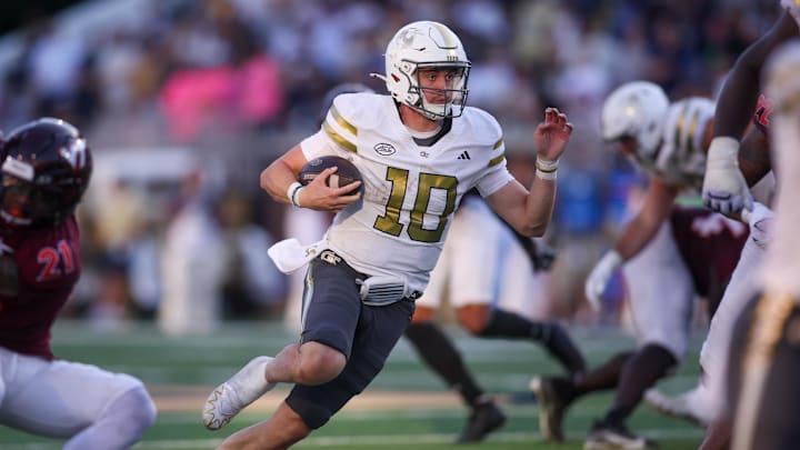 Oct 11, 2025; Atlanta, Georgia, USA; Georgia Tech Yellow Jackets quarterback Haynes King (10) runs the ball for a touchdown against the Virginia Tech Hokis in the fourth quarter at Bobby Dodd Stadium at Hyundai Field. Mandatory Credit: Brett Davis-Imagn Images