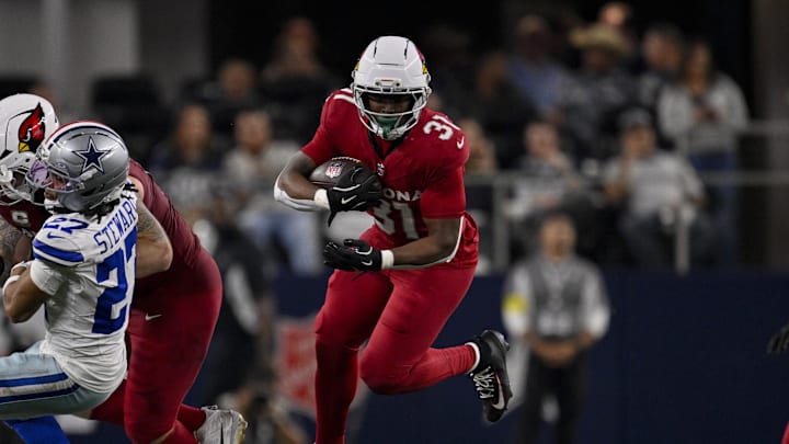 Nov 3, 2025; Arlington, Texas, USA; Arizona Cardinals running back Emari Demercado (31) runs with the ball during the game between the Dallas Cowboys and the Arizona Cardinals at AT&T