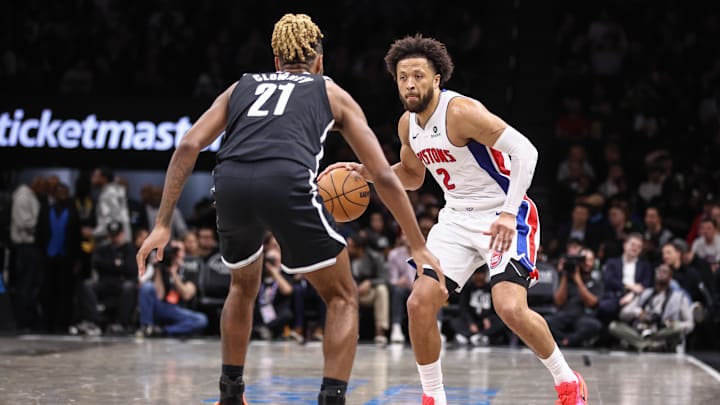 Mar 10, 2026; Brooklyn, New York, USA;  Detroit Pistons guard Cade Cunningham (2) looks to drive past Brooklyn Nets forward Noah Clowney (21) in the third quarter at Barclays Center. Mandatory Credit: Wendell Cruz-Imagn Images