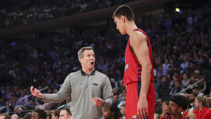 Mar 25, 2023; New York, NY, USA; Florida Atlantic Owls head coach Dusty May talks with Florida Atlantic Owls center Vladislav Goldin (50) during the first half of an NCAA tournament East Regional final against the Kansas State Wildcats at Madison Square Garden. Mandatory Credit: Brad Penner-USA TODAY Sports