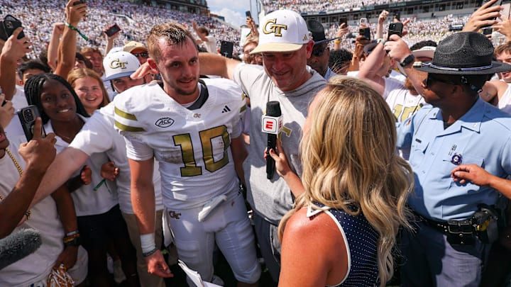 Sep 13, 2025; Atlanta, Georgia, USA; Georgia Tech Yellow Jackets quarterback Haynes King (10) and head coach Brent Key talk to a reporter after a victory over the Clemson Tigers at Bobby Dodd Stadium at Hyundai Field. Mandatory Credit: Brett Davis-Imagn Images