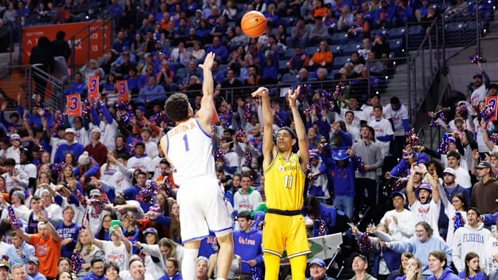 Jan 14, 2025; Gainesville, Florida, USA; Florida Gators guard Walter Clayton Jr. (1) attempts to block a three point basket from Missouri Tigers guard Trent Pierce (11) during the first half at the Stephen C. O'Connell Center in Gainesville, FL on Tuesday, January 14, 2025. Mandatory Credit: Matt Pendleton-Imagn Images