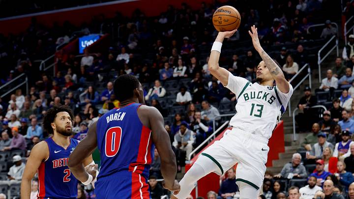 Dec 6, 2025; Detroit, Michigan, USA;  Milwaukee Bucks guard Ryan Rollins (13) shoots on Detroit Pistons center Jalen Duren (0) and guard Cade Cunningham (2) in the first half at Little Caesars Arena. Mandatory Credit: Rick Osentoski-Imagn Images